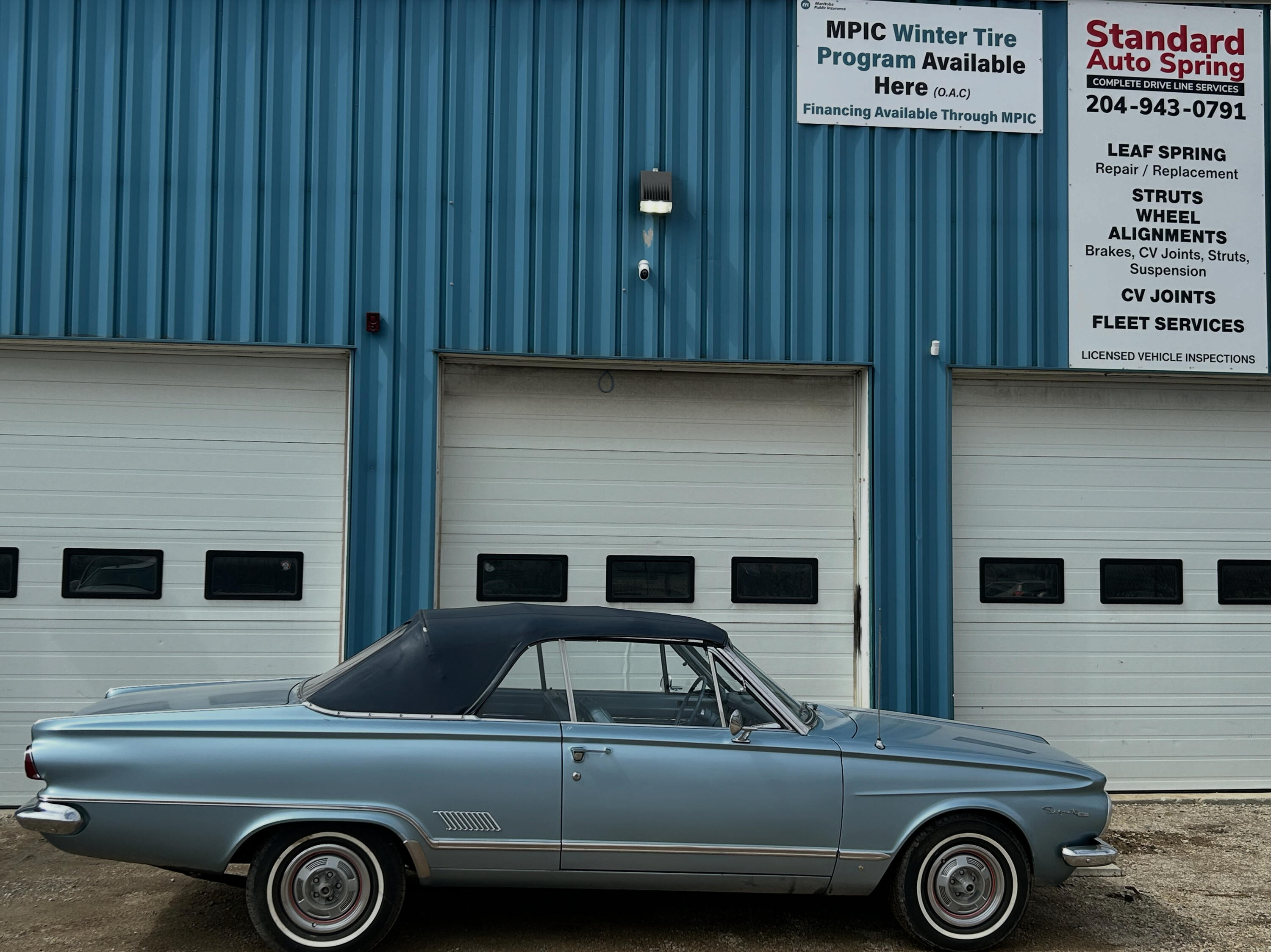 Classic Leaf Springs | Vintage & Antique Vehicle Spring Specialists Classic vintage automobile parked outside Standard Auto Spring Works in Winnipeg. Custom leaf spring manufacturing, restoration, re-arching, and repair services for antique cars, classic trucks, and collector vehicles.