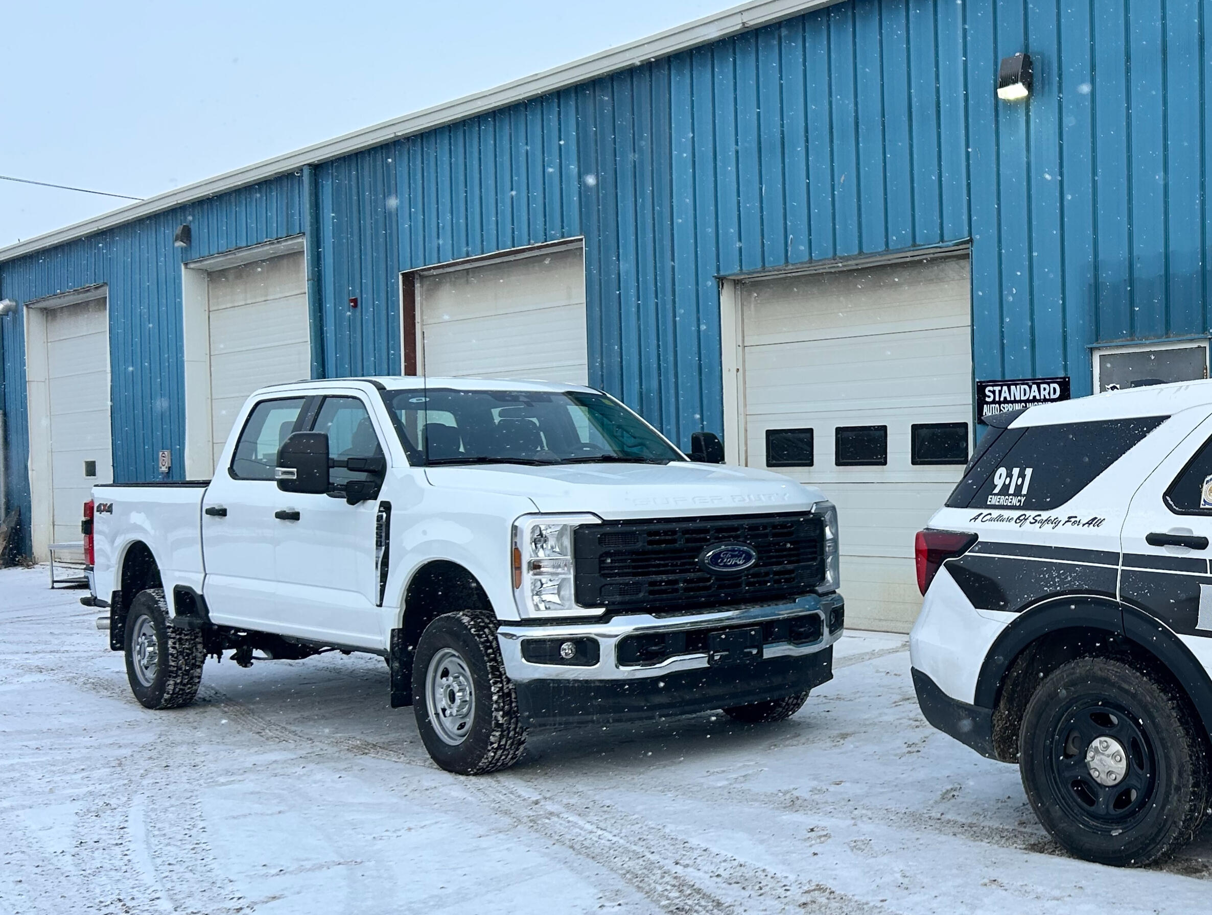 Fleet Maintenance & Commercial Vehicle Service | Standard Auto Spring Works Commercial fleet pickup truck parked outside Standard Auto Spring Works in Winnipeg, Manitoba. Fleet maintenance, suspension repair, wheel alignments, and commercial vehicle support.